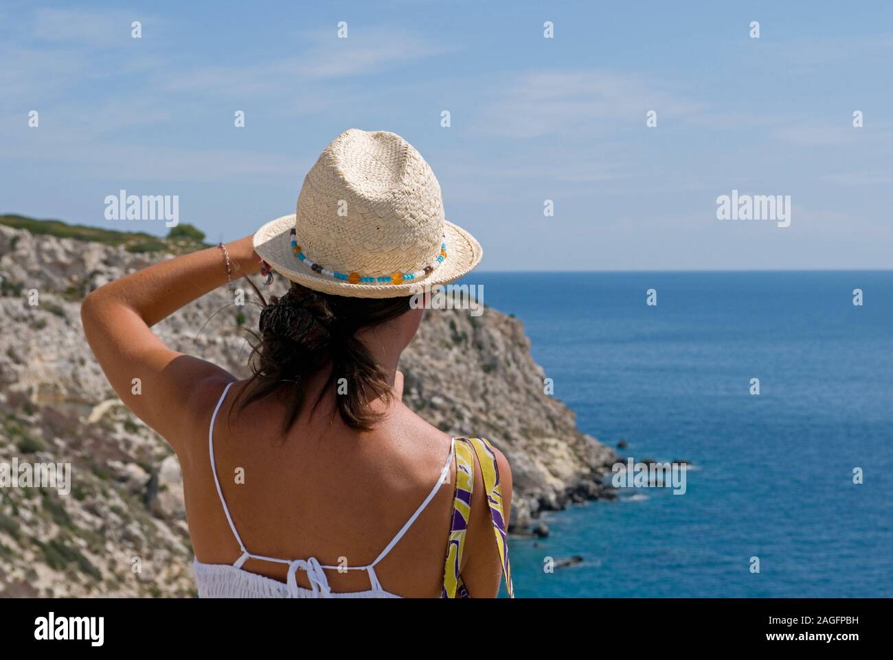 young woman with sunhat taking pictures, Salento, Apulia, Italy Stock Photo
