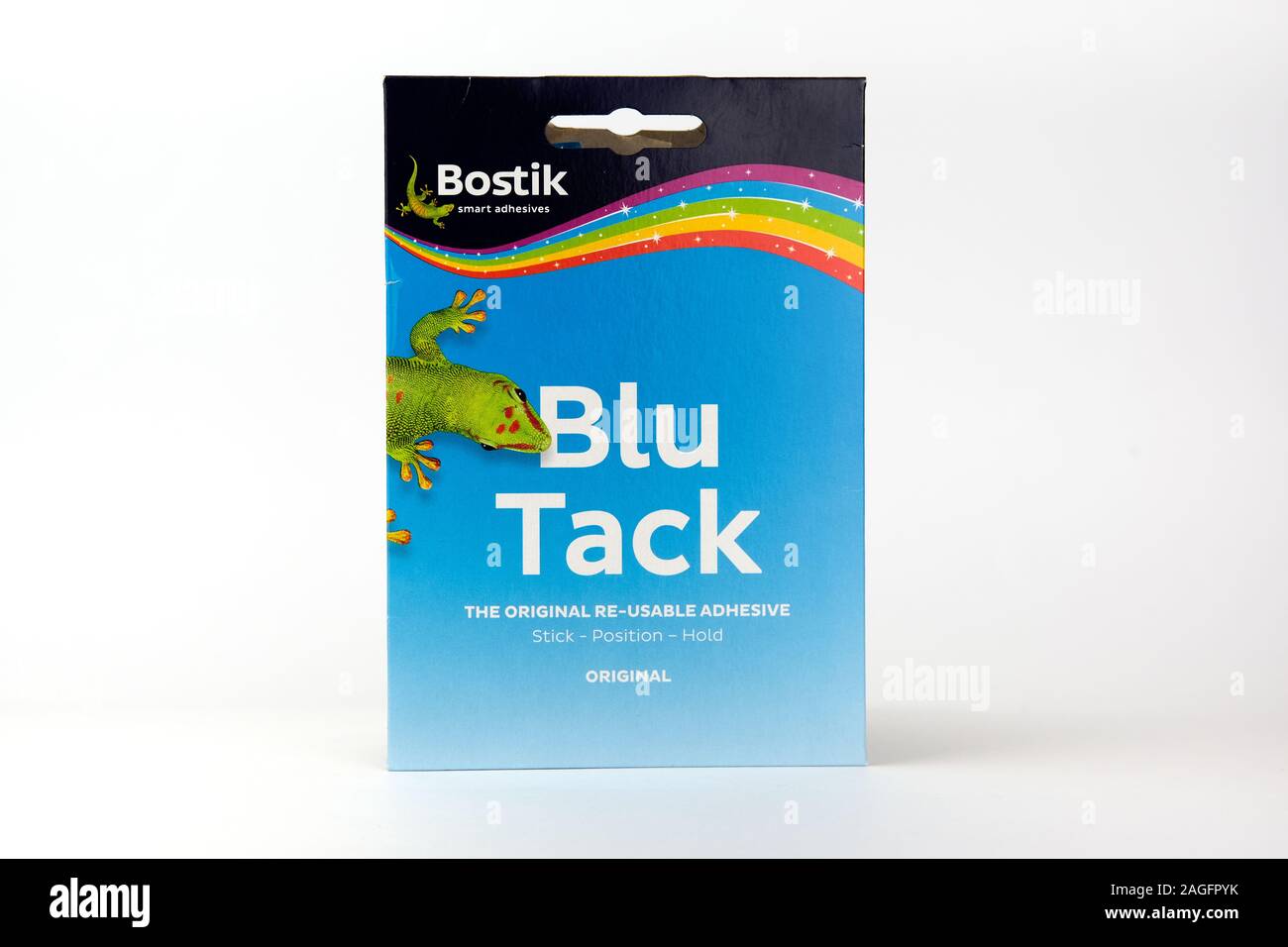 Blu Tack in the retail package. Popular adhesive paste commonly used to attach lightweight objects to walls. Stock Photo