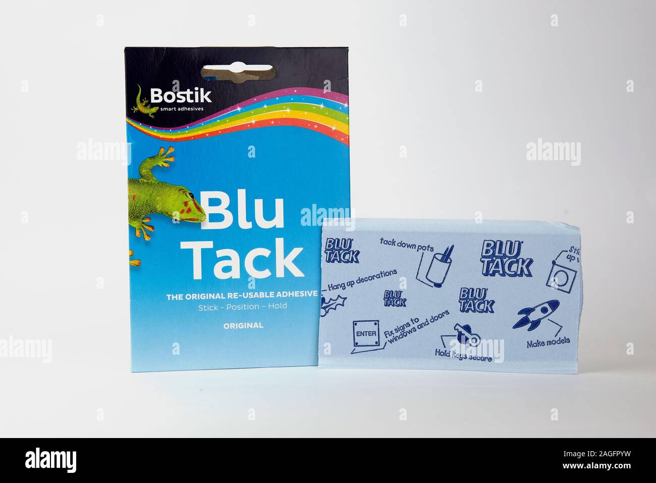 Blu Tack in the retail package. Popular adhesive paste commonly used to attach lightweight objects to walls. Stock Photo