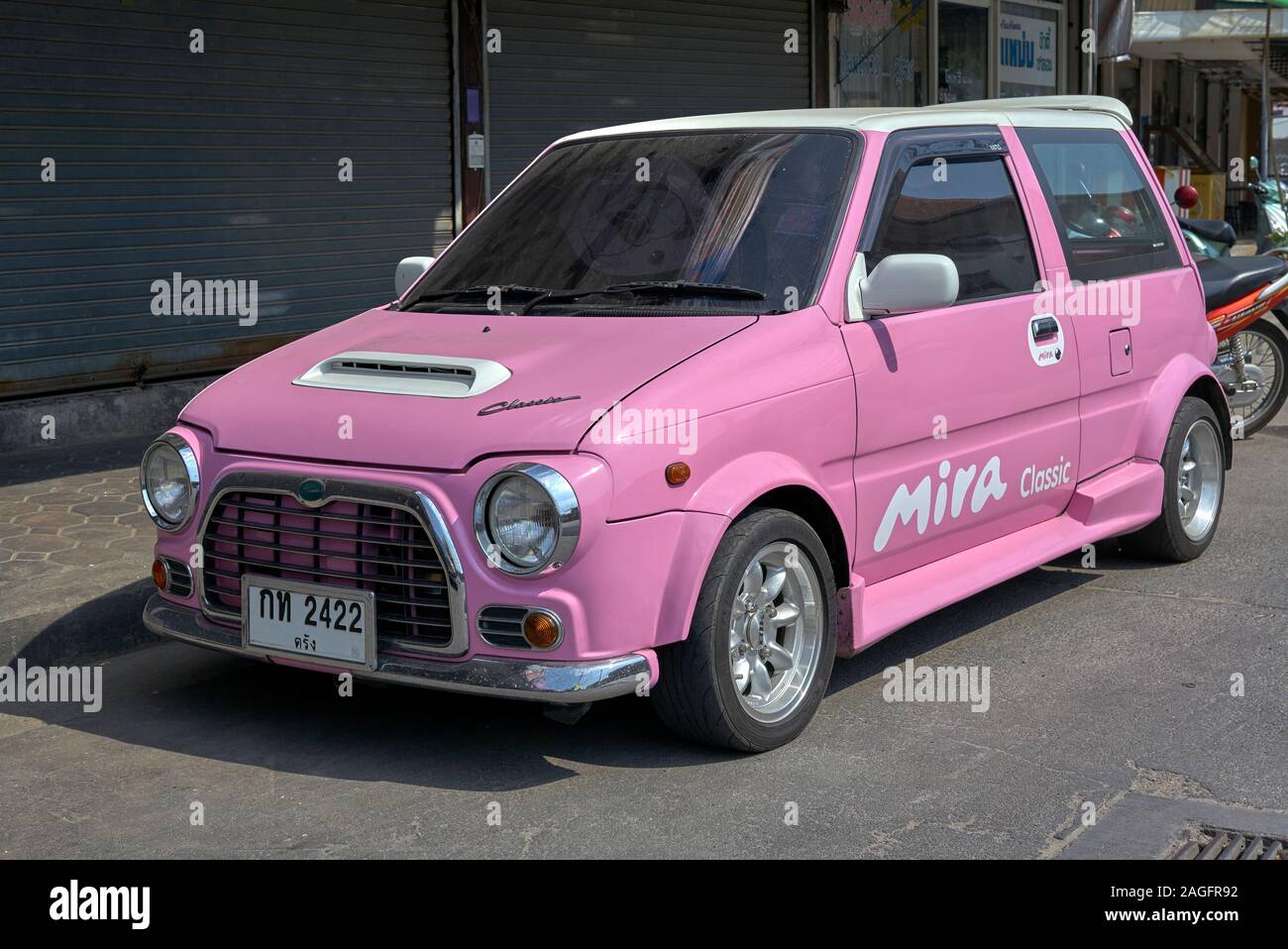 Daihatsu mira classic pink car Thailand Stock Photo