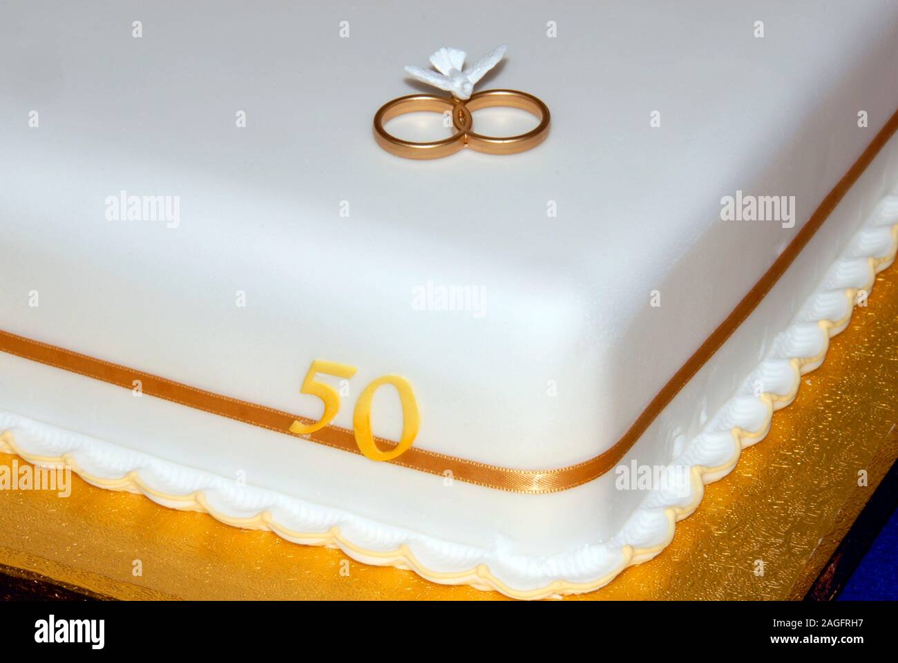 pic Celebration Cake Single Tier 50Th Wedding Anniversary Cakes https www alamy com close up of corner of single tier square celebration cake fot golden wedding fifty years of marriage showing two gold rings and figures 50 image337179283 html