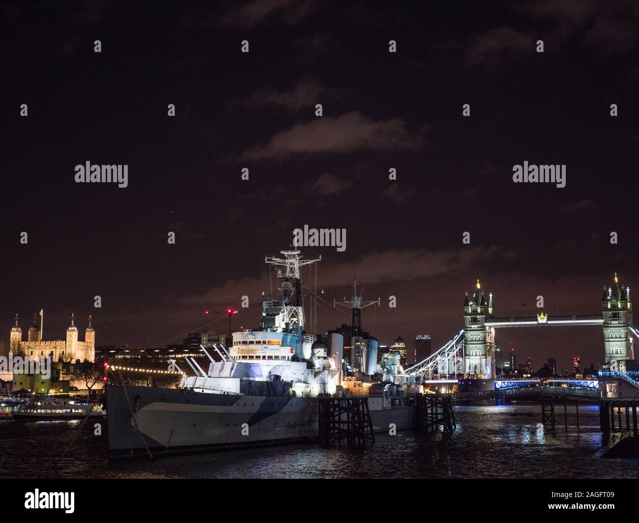 River Thames at Night Time, Tower of London, HMS Belfast, Tower Bridge, London, England, UK, GB. Stock Photo
