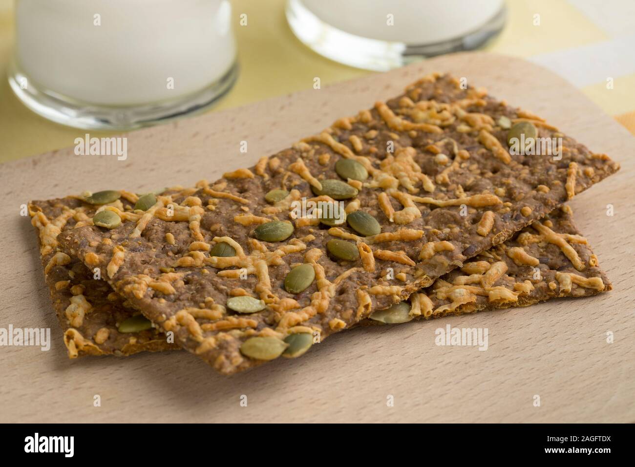 Close up of whole grain cheese cracker with pumpkin seed for breakfast Stock Photo