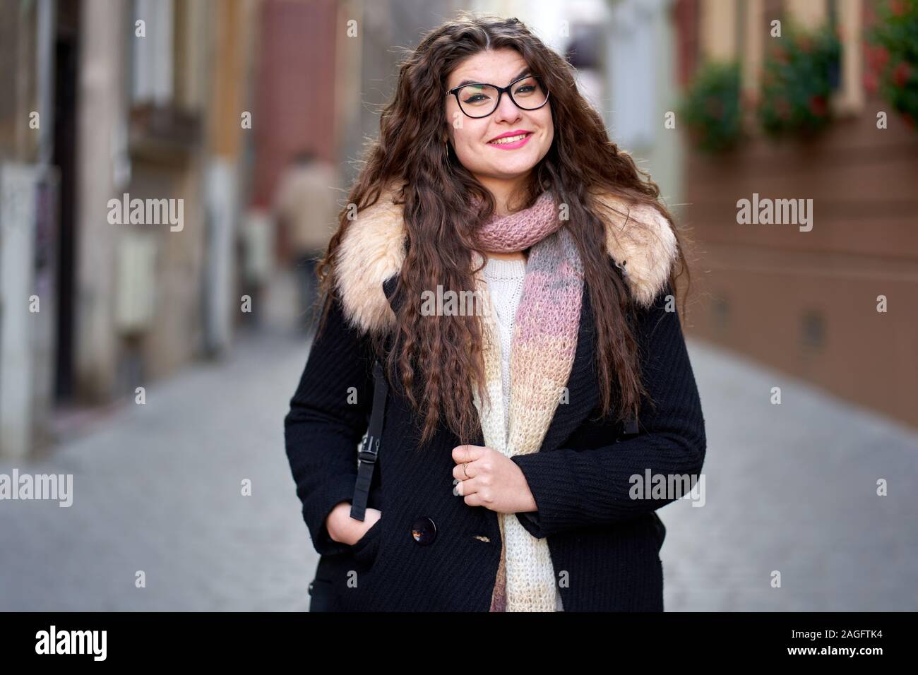Closeup of a young woman with long wavy hair outdoor Stock Photo - Alamy