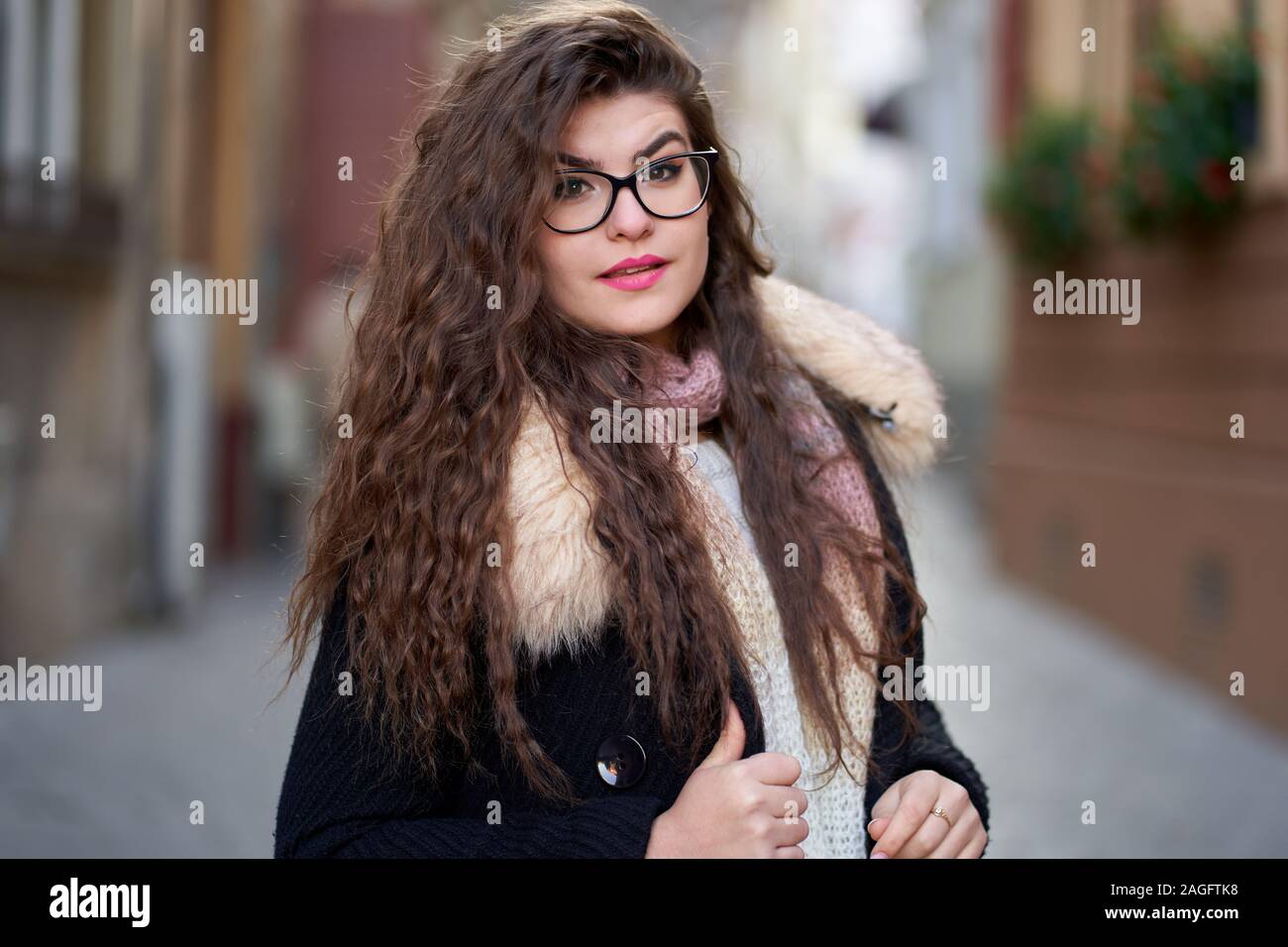 Closeup of a young woman with long wavy hair outdoor Stock Photo - Alamy
