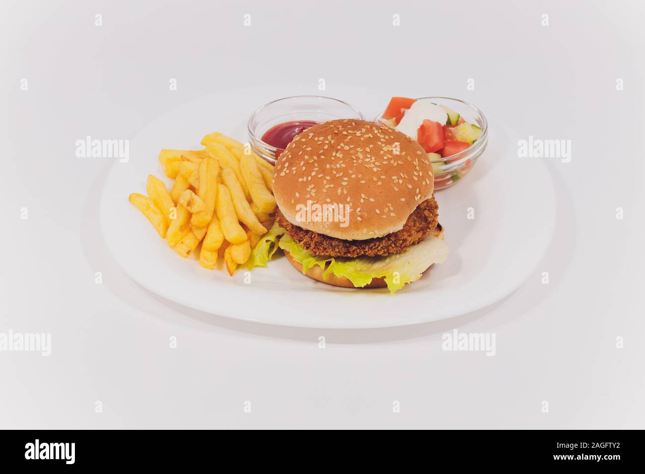 Mini Burger platter with fries Salad isolated on white background Stock Photo