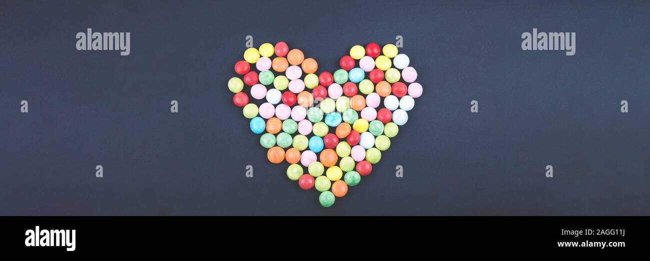 Candy Valentines Hearts on Dark Background. Banner Stock Photo