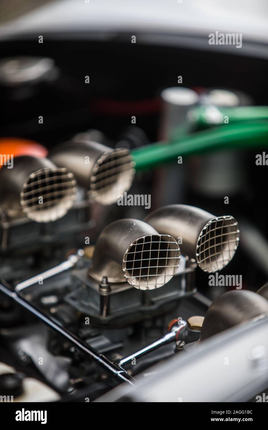 Color close up of the air intake hoses of a sports engine of a car