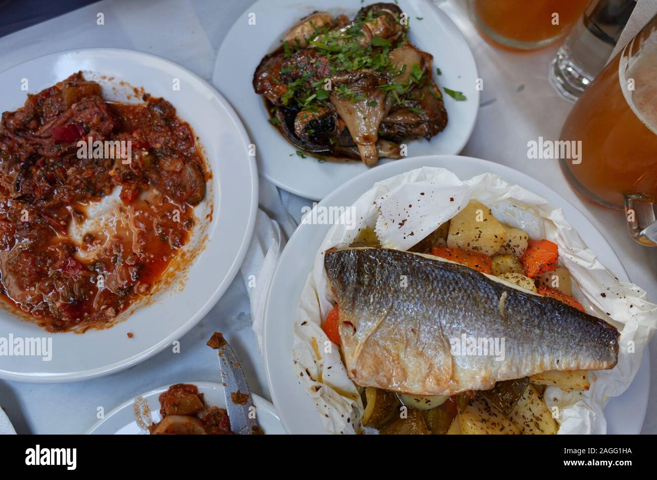 Greek taverna food, sea bass , squid and mushroom Stock Photo