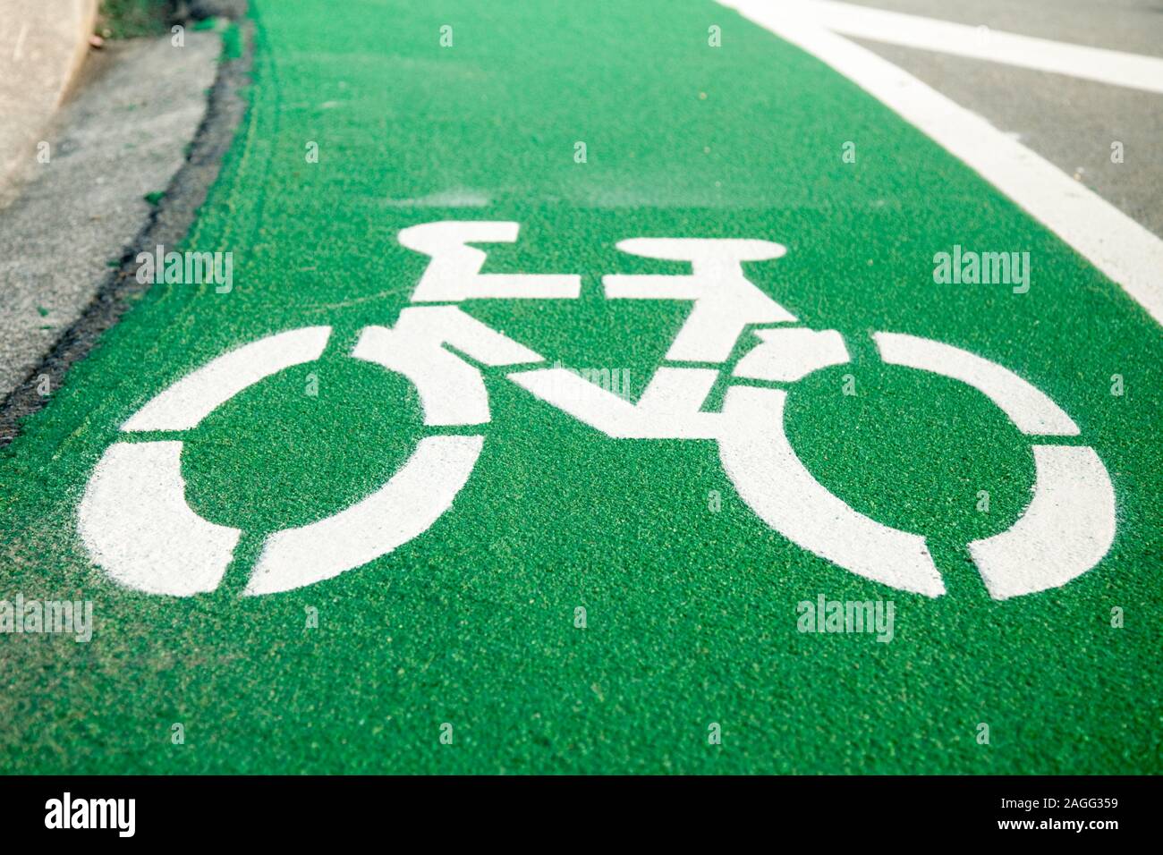 Empty green cycle track with bike lane sign Stock Photo