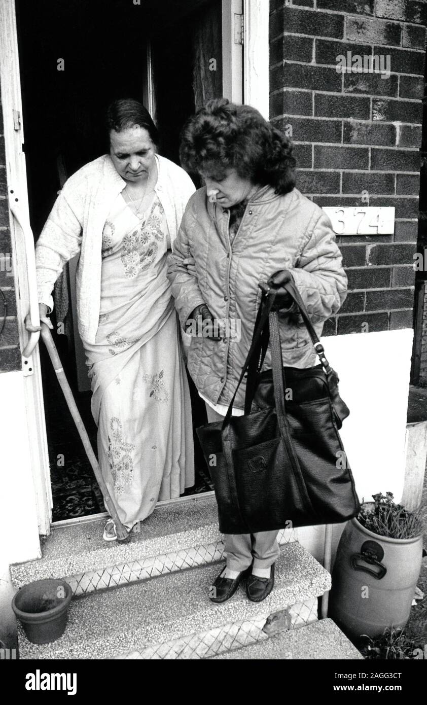 Carer & elderly woman, Nottingham UK 1989 Stock Photo