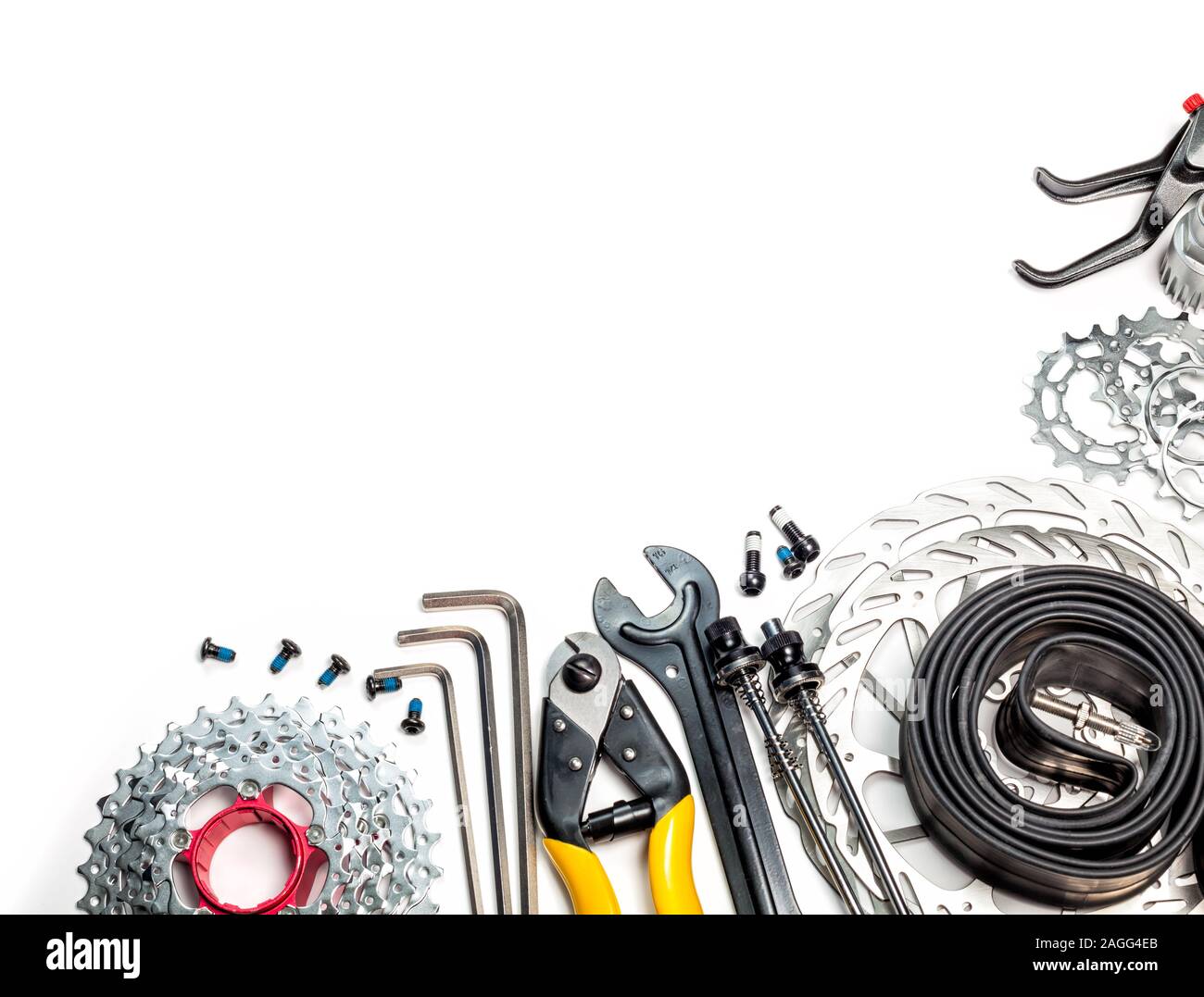 Mountain bike spares cassette gear skewers brake disk rotors levers tube sprockets and tools allen keys cable cutter on white background Stock Photo Alamy