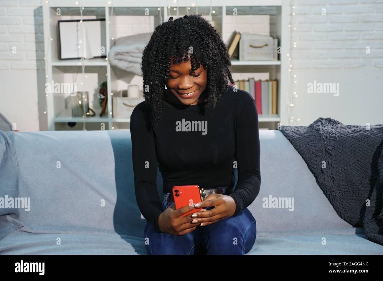 Pretty African American Lady With Curly Hair Types On Modern Red