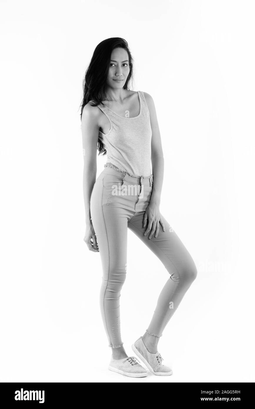 Full body shot of young beautiful Asian woman posing Stock Photo
