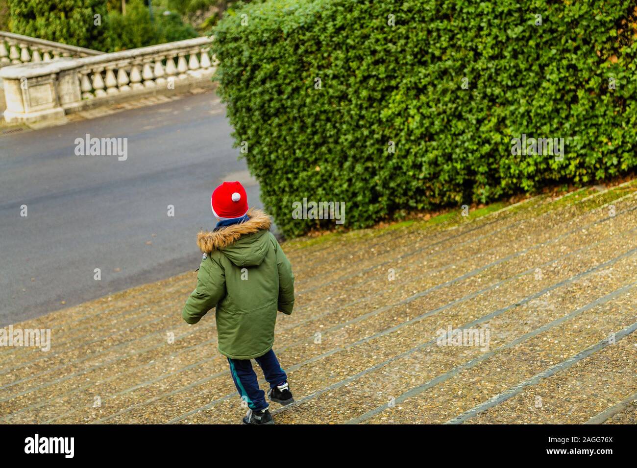 kid walking down ancient stairs Stock Photo - Alamy