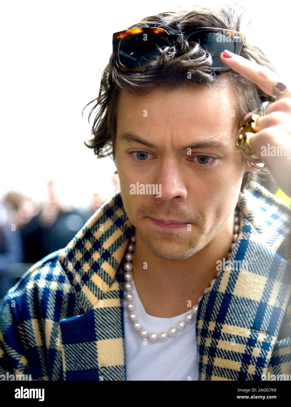 Harry Styles - One Direction Singer - meeting a large crowd of fans outside  BBC Broadcasting House after doing an interview for Radio 1 to promote his  Stock Photo - Alamy