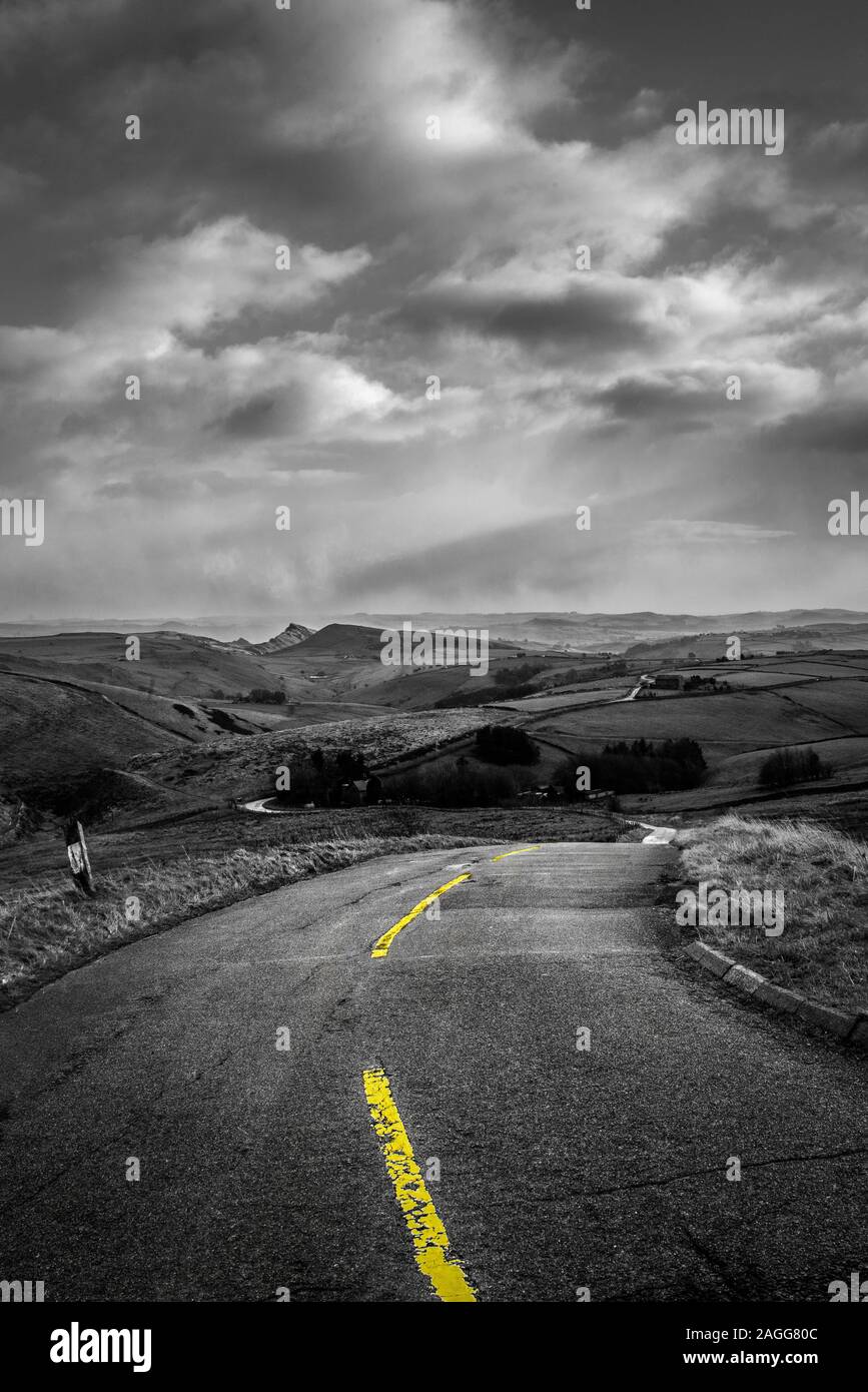 An empty road to nowhere. A quiet desolate, deserted, empty road in the Derbyshire Peak District National Park, empty highway, road in the countryside Stock Photo