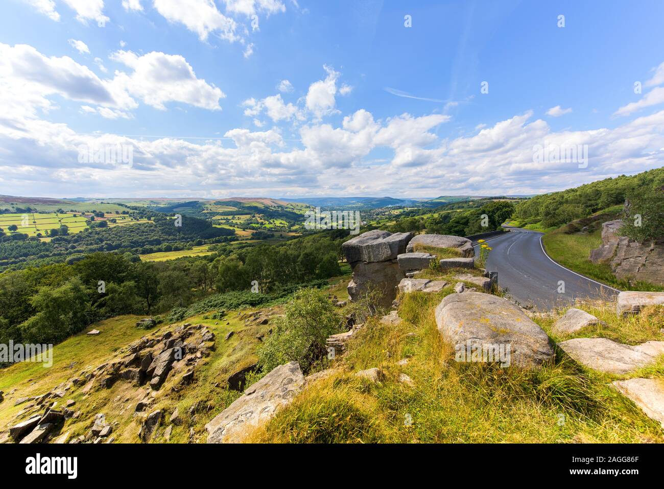 A winding meandering road flowing through the Peak District National