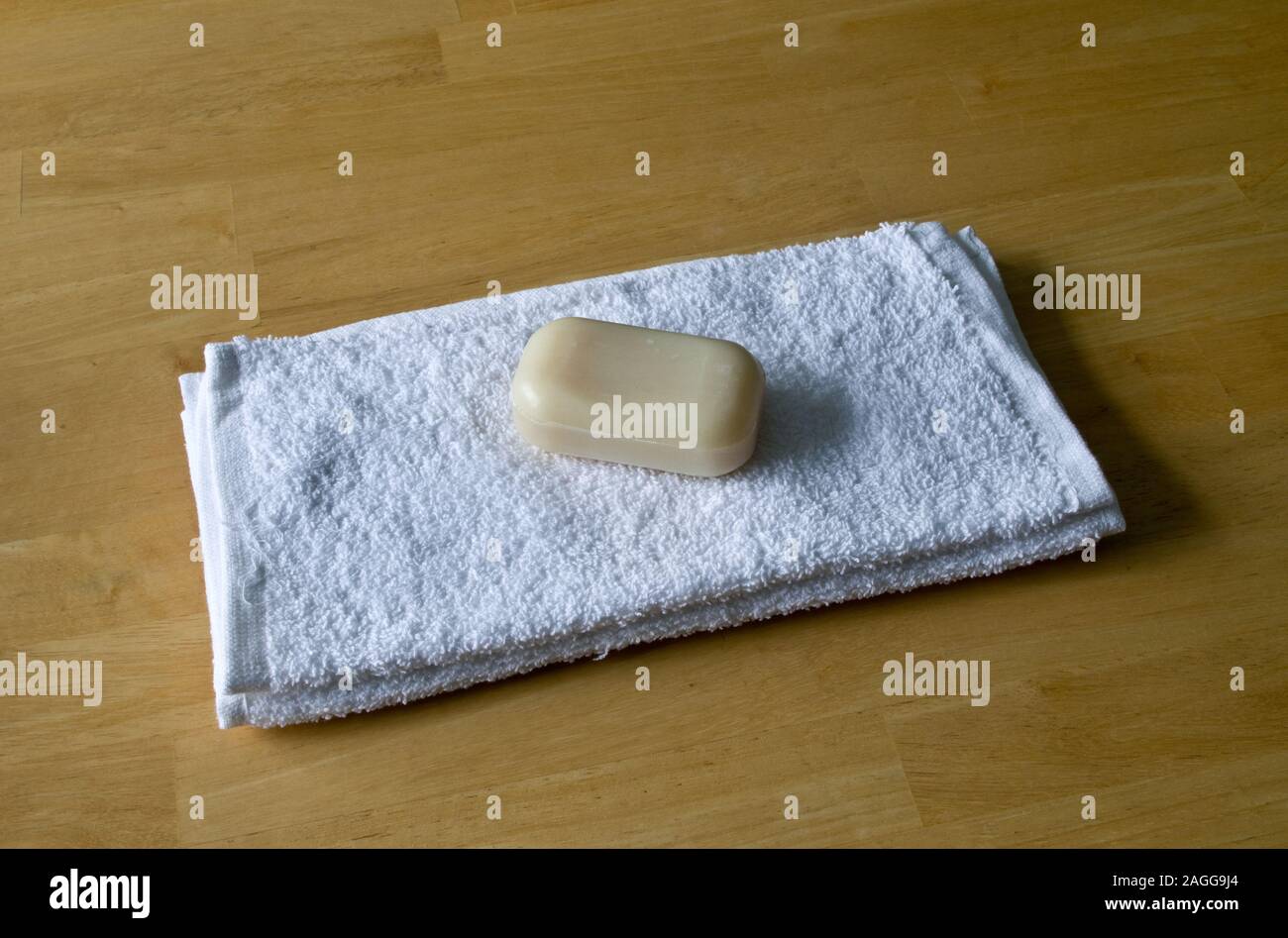 White Cotton Flannels with a Bar of Soap Stock Photo