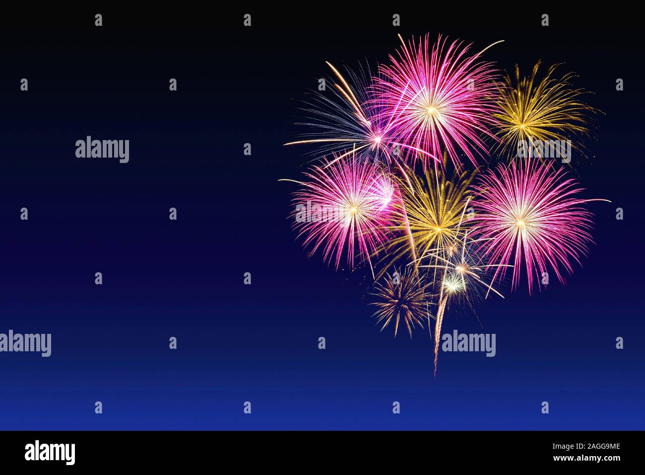Colorful fireworks celebration and the twlight sky background. Stock Photo
