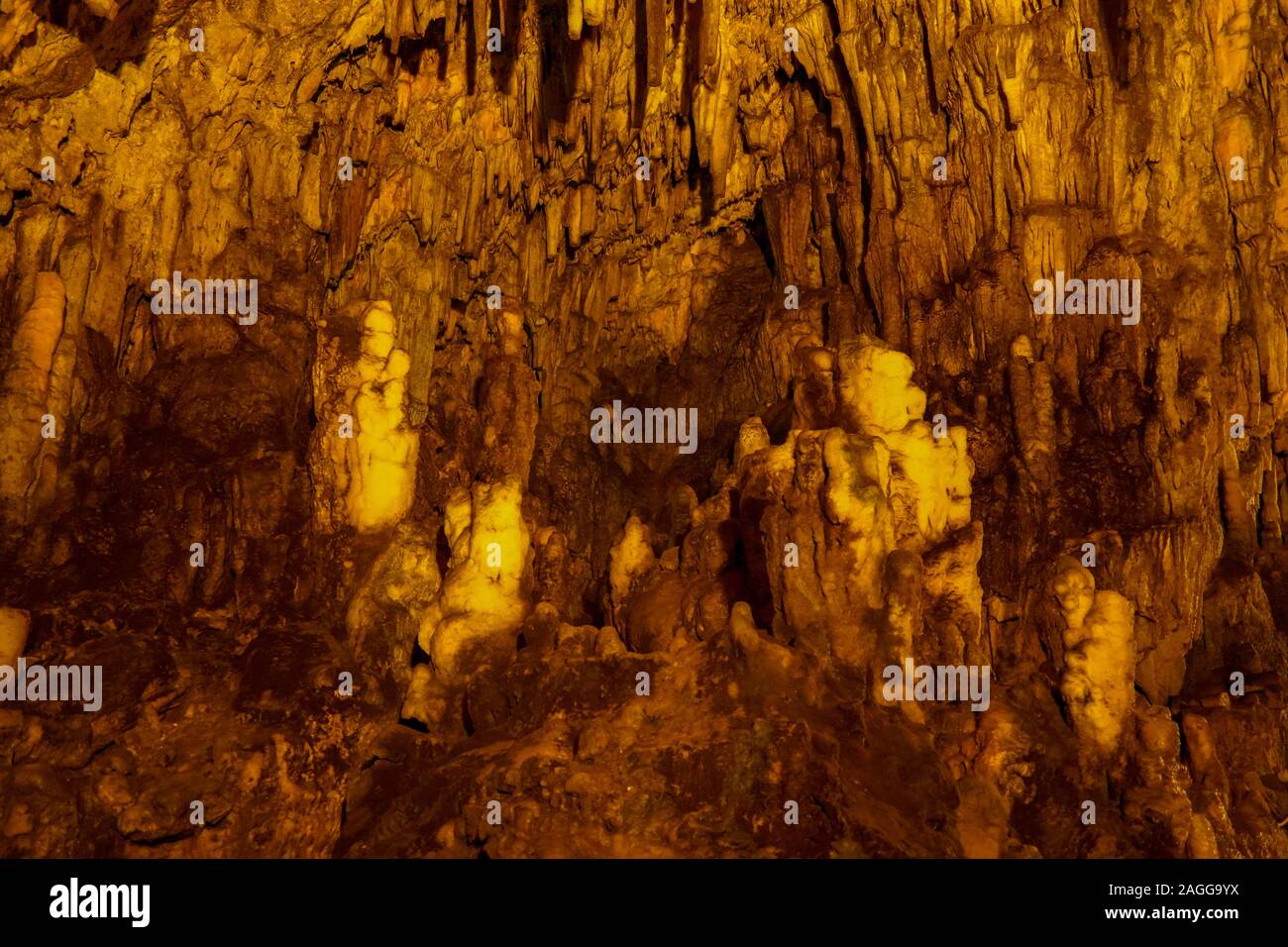Drogarati cave on Cephalonia Island illuminated in orange, Greece Stock Photo