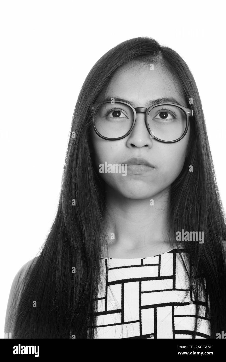Face of young Asian teenage nerd girl thinking Stock Photo Alamy