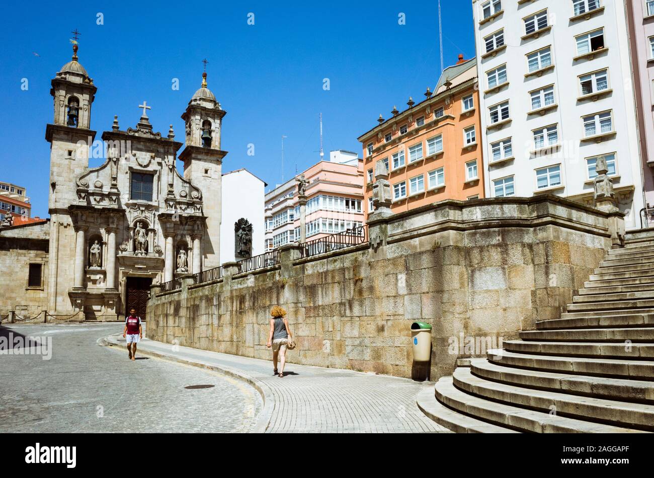 Coruña, Spain A woman walks towards St. Church (Iglesia de San