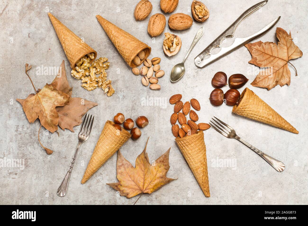 Ice cream cones with nuts on a marble table Stock Photo