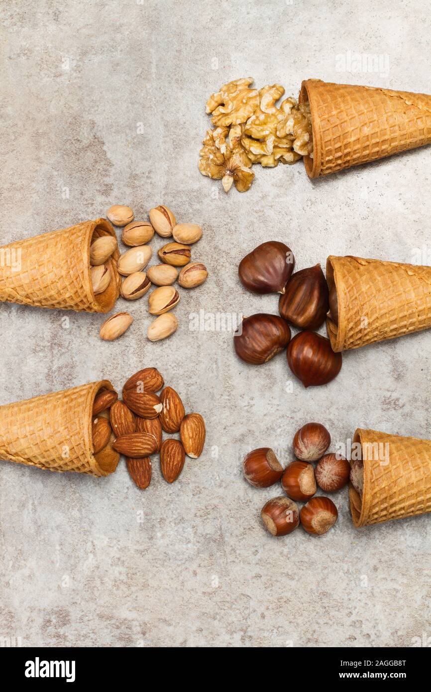 Ice cream cones with nuts on a marble table Stock Photo
