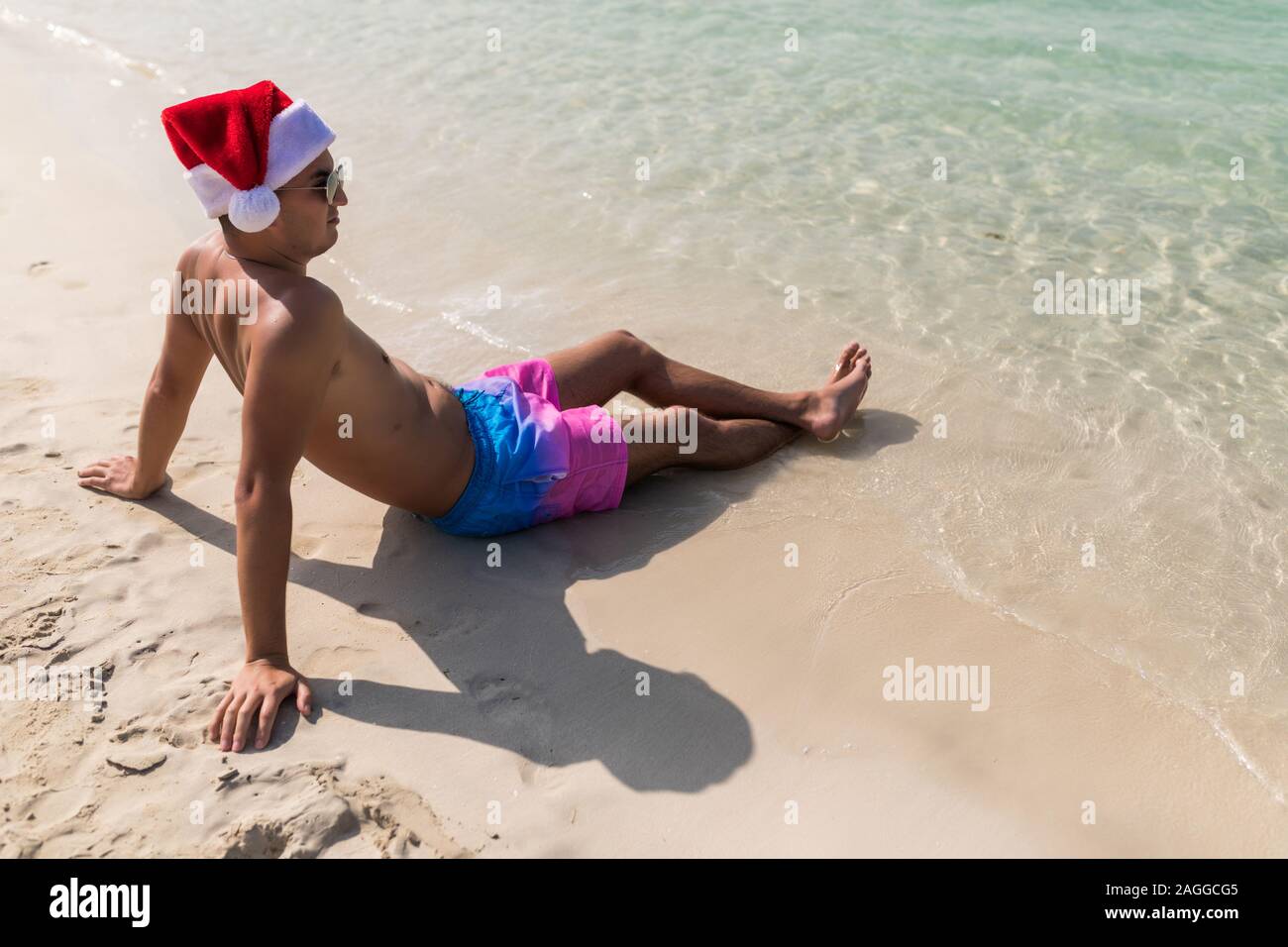 Young handsome man in santa hat from 