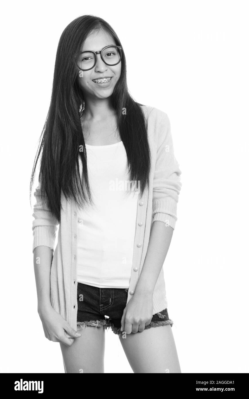 Studio shot of young happy Asian teenage girl smiling Stock Photo - Alamy