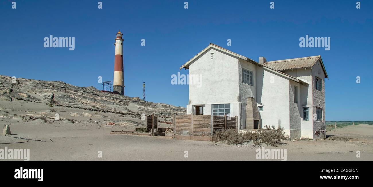 The lighthouse keeper's house on Diaz Point with the light in the background. Stock Photo