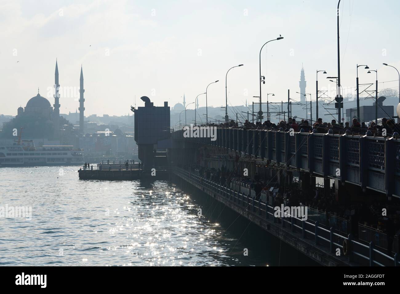 People fishing at Galata Bridge in a sunny day, Beyoglu, Istanbul, Turkey. Stock Photo