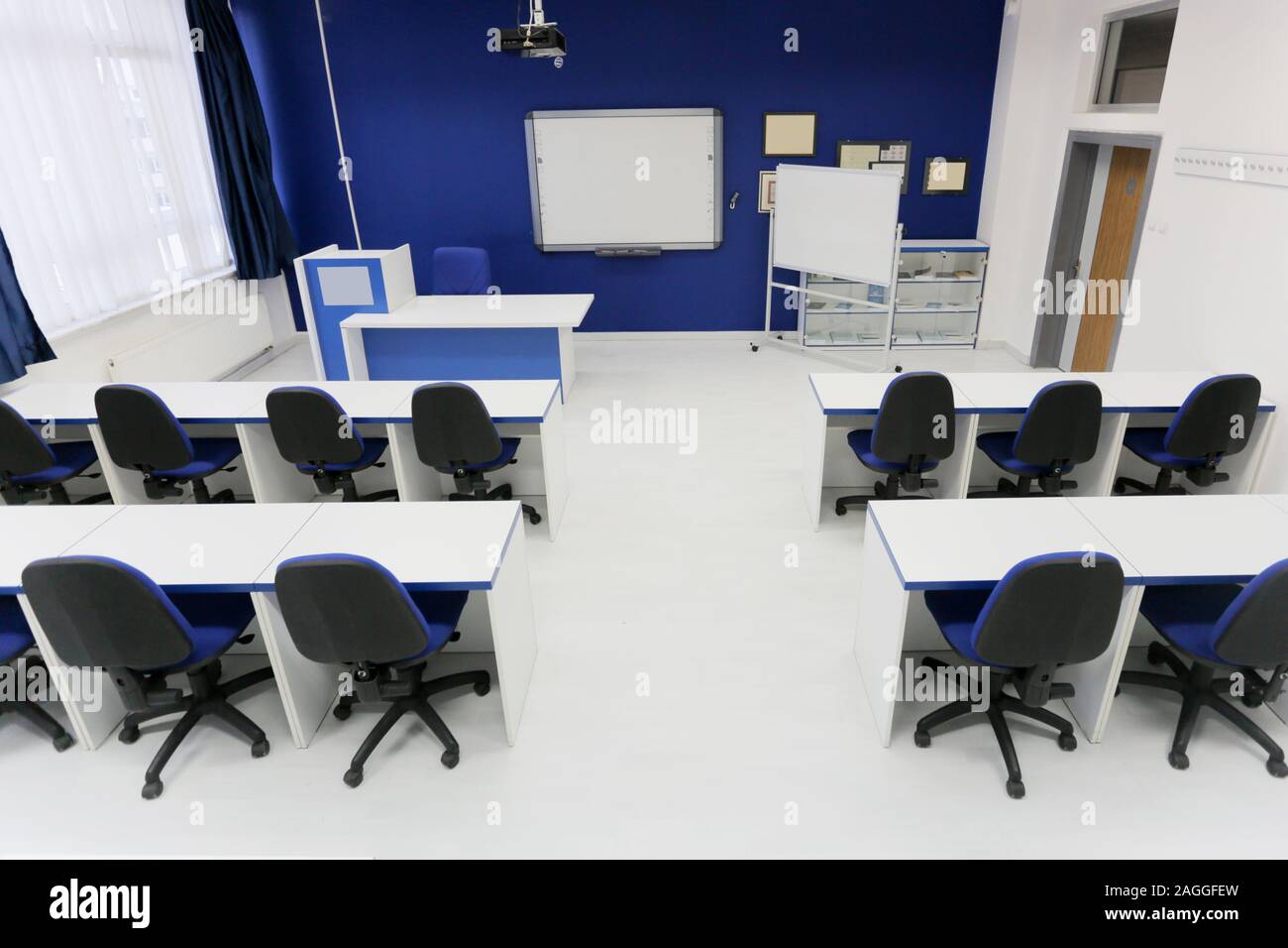 Economy School Classroom With Smart Board And Without Students Or Teacher With Chairs And Tables In Campus Modern Education Concept Stock Photo Alamy