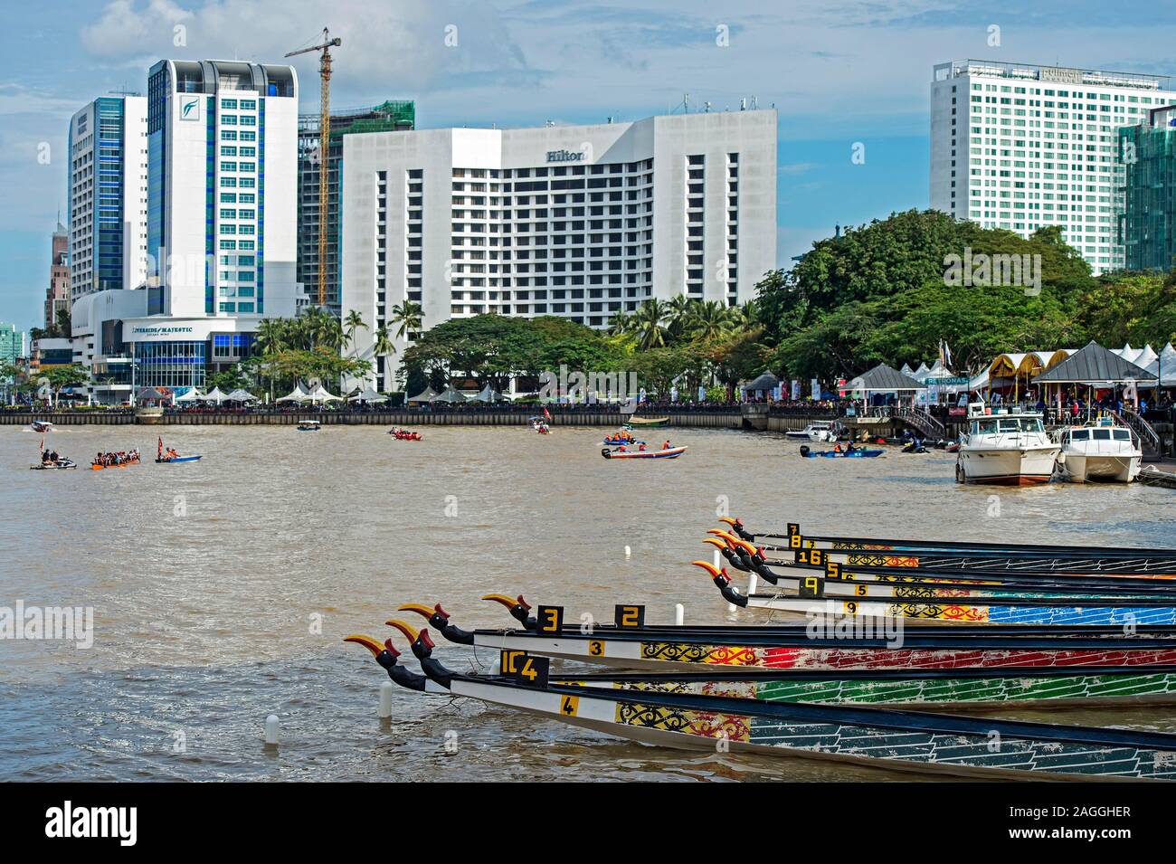 Kuching Waterfront at Sarawak river with traditional boats and Hotel buildings, Kuching, Sarawak, Borneo, Malaysia Stock Photo
