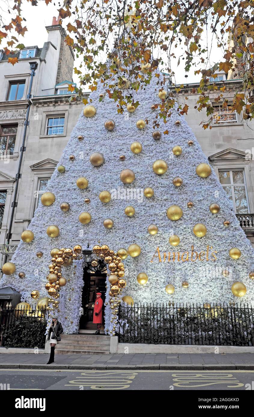Exterior view of Annabels private club on Berkeley Square Mayfair with gold Christmas baubles decorations in West London W1 England UK  KATHY DEWITT Stock Photo