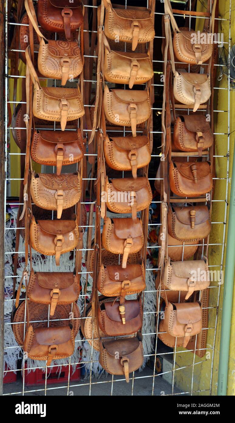 vendor illegally selling imitation name brand handbags on Canal Street  Manhattan New York Stock Photo - Alamy