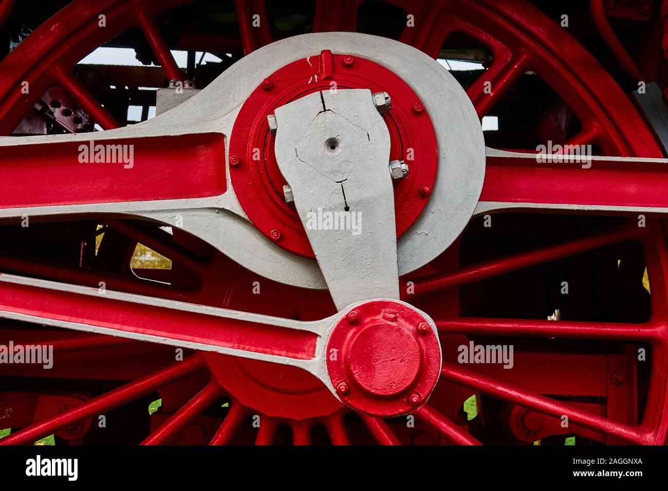 Restored connecting rods of a historical locomotive in strong red shades Stock Photo