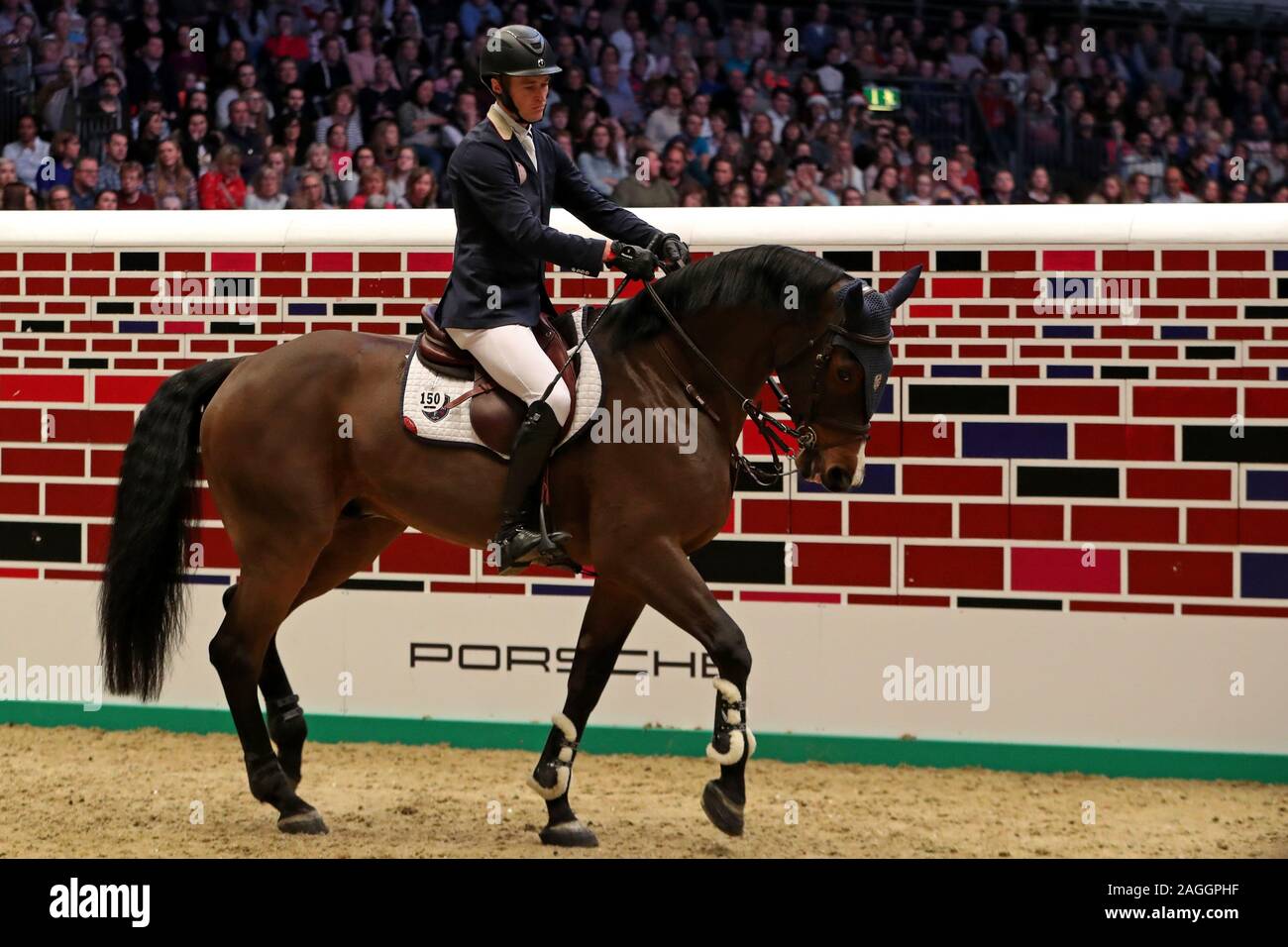 LONDON, ENGLAND - DECEMBER 18TH William Whitaker riding RMF Charly during the Cayenne Puissance Event at the International Horse Show at Olympia, London on Wednesday 18th December 2019. (Credit: Jon Bromley | MI News) Stock Photo