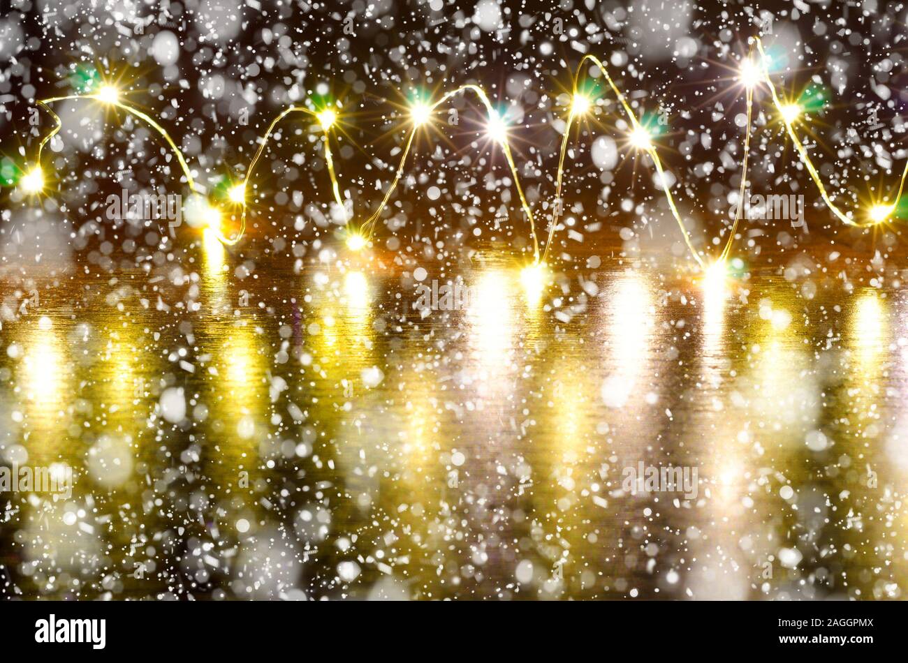 christmas background with garland light and snow Stock Photo Alamy