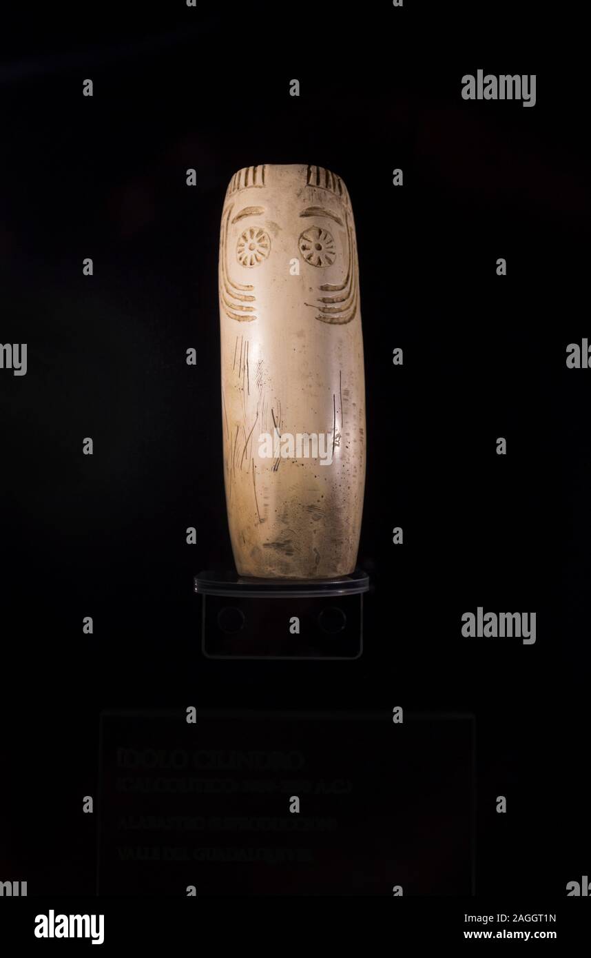 Cabra, Spain - May 19th, 2019: Cylindrical alabaster idol from Guadalquivir Valley from 3000 BC. Facial features Stock Photo