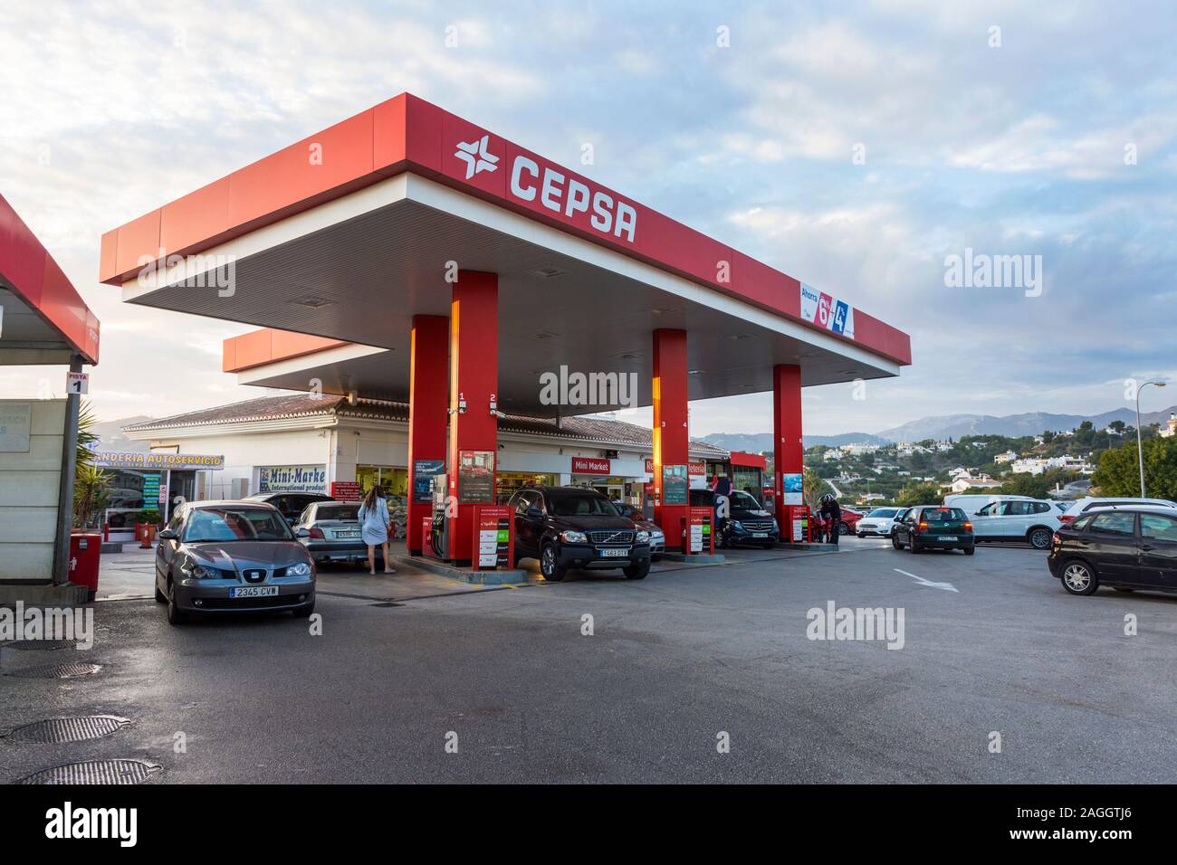 Nerja, Andalusia, Spain. Cepsa petrol or gas station. People fueling their cars. Stock Photo