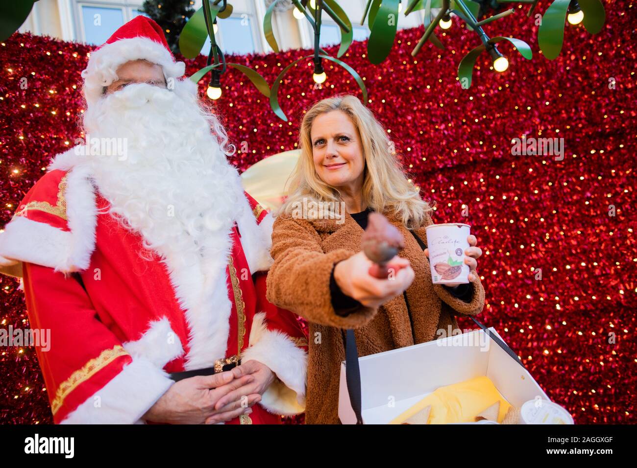 Cologne, Germany. 19th Dec, 2019. Barbara Schöneberger, presenter, promotes the ice cream manufacturer 'Charlotte' at the Christmas market. Credit: Rolf Vennenbernd/dpa/Alamy Live News Stock Photo