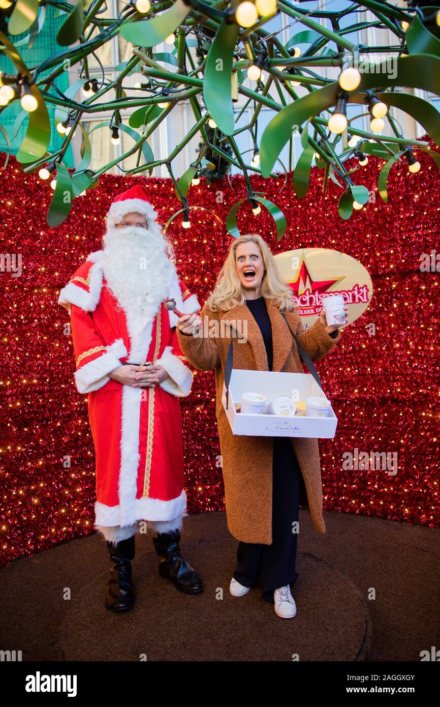 Cologne, Germany. 19th Dec, 2019. Barbara Schöneberger, presenter, promotes the ice cream manufacturer 'Charlotte' at the Christmas market. Credit: Rolf Vennenbernd/dpa/Alamy Live News Stock Photo