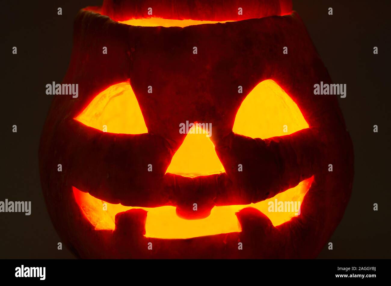 halloween pumpkin face on a black background Stock Photo - Alamy