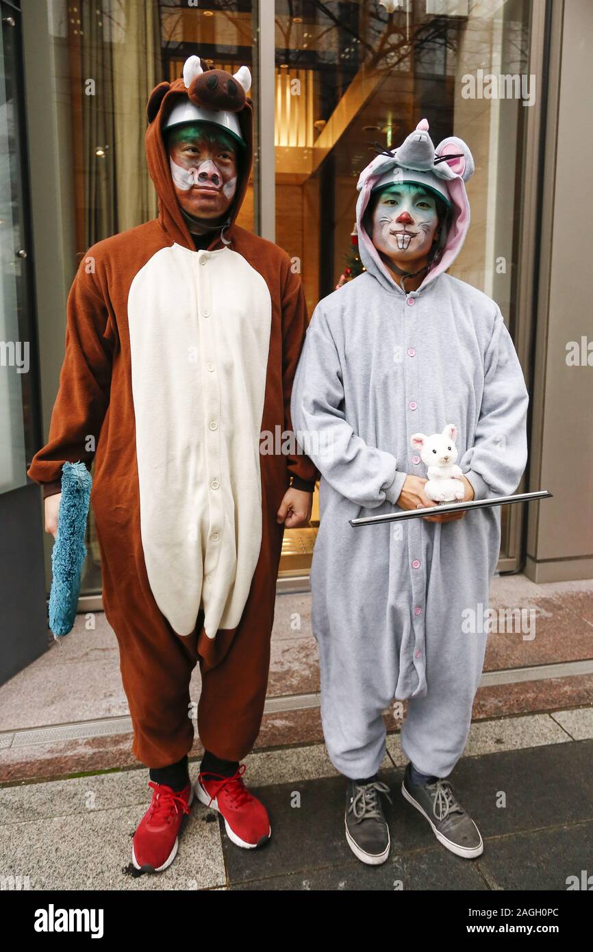 Tokyo, Japan. 19th Dec, 2019. Window cleaners dressed as a wild boar ...