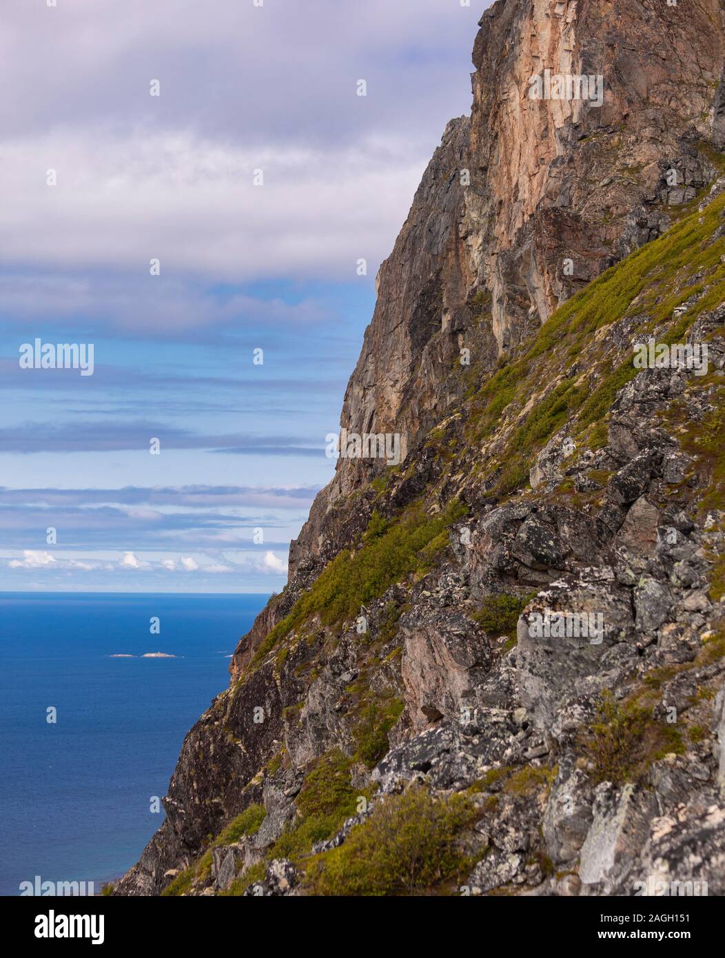 REKVIK, KVALØYA ISLAND, TROMS COUNTY, NORWAY - Cliff and ocean at  Brosmetinden mountain Stock Photo - Alamy