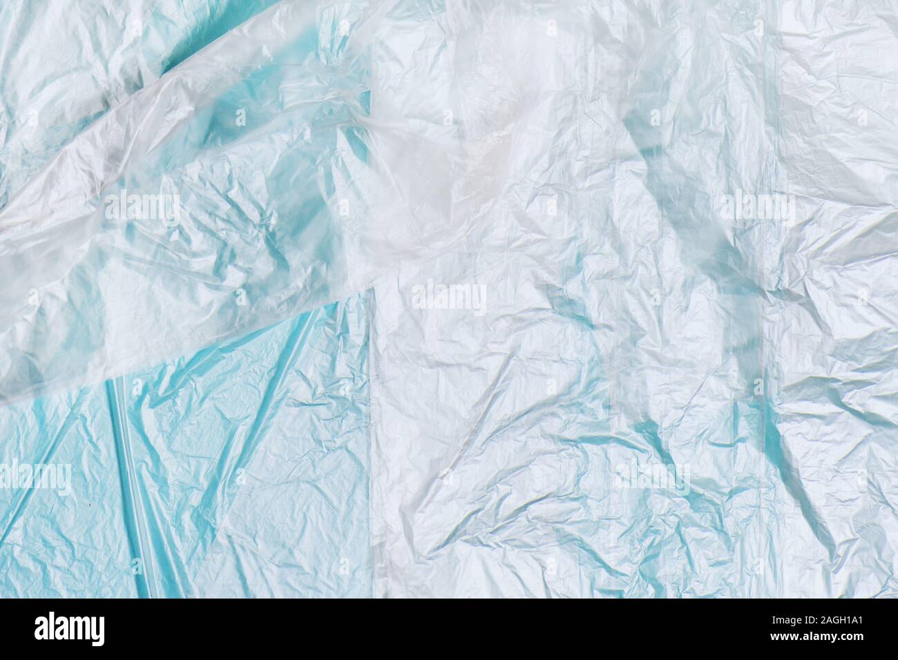 Plastic bags texture on blue background. Zero waste conept. Stock Photo