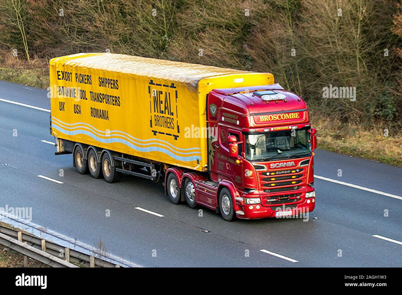 Proscomber Haulage delivery trucks, lorry, transportation, truck, cargo carrier, red Scania super vehicle, European commercial transport, industry, M61 at Manchester, UK Stock Photo