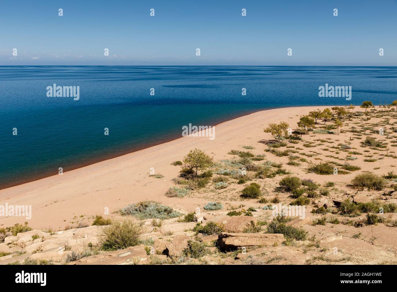 Lake Issyk-kul, empty sandy beach on the southern shore of the lake, Kyrgyzstan Stock Photo